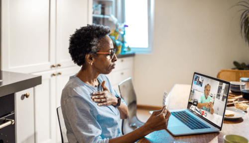 Senior woman on video call with doctor