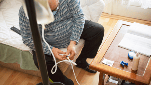 an adult person is doing home dialysis